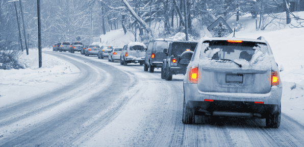 Cars driving in winter weather|Woman packing her bag||Cars queued up in traffic in the snow