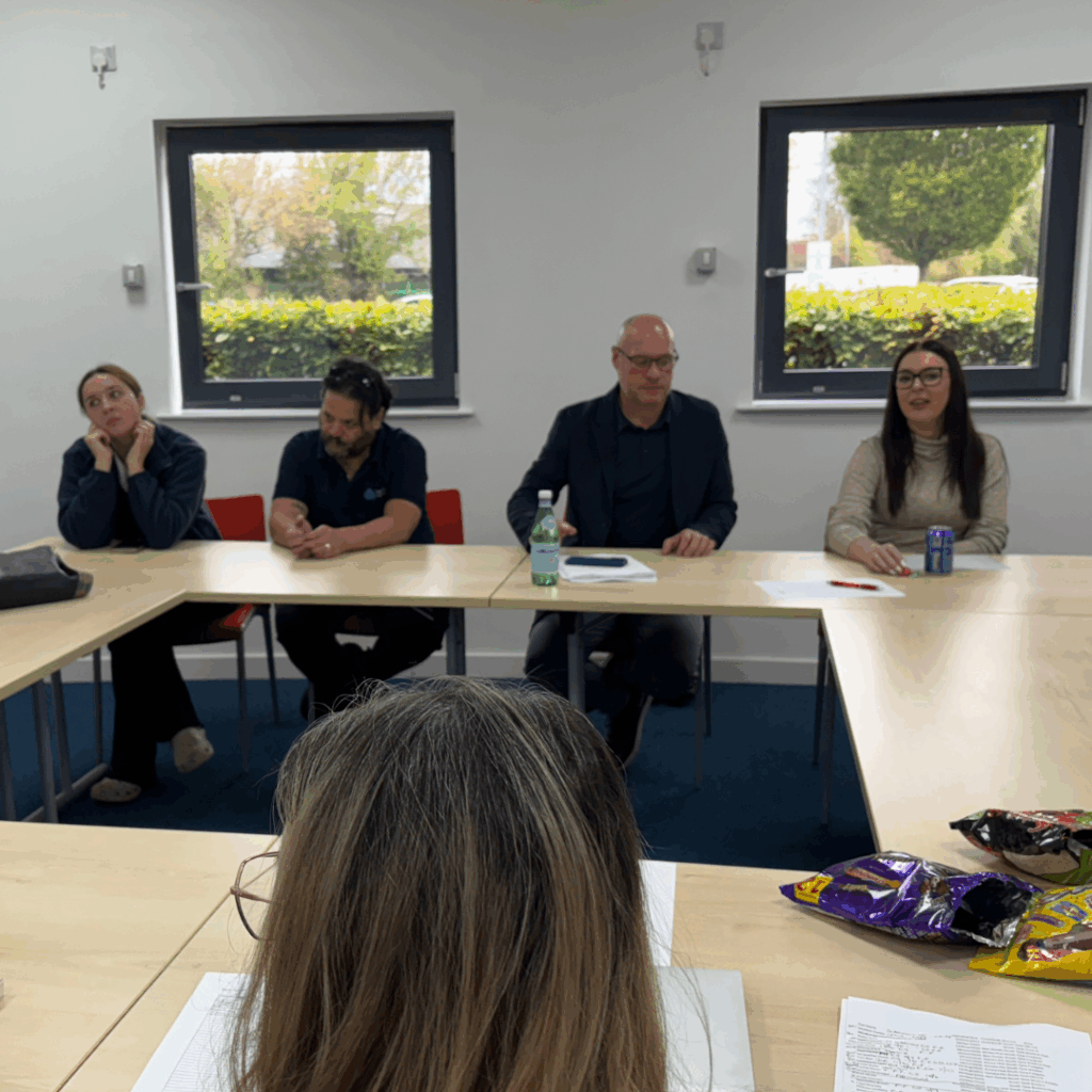 Team meeting with several of our carers and our Regional Director, Mike.